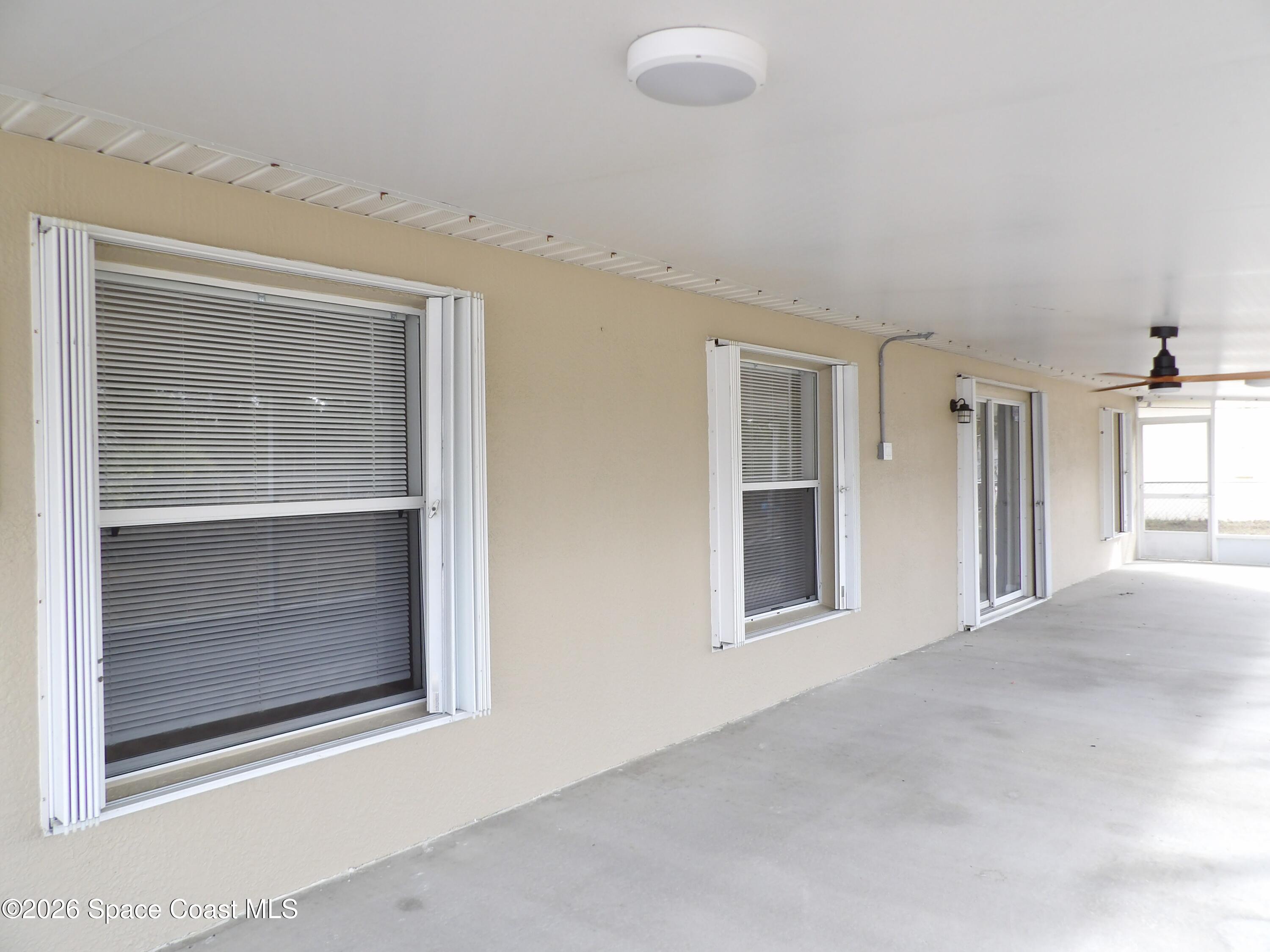 542 Octavius Road Southwest Palm Bay, FL 32908 - Photo 31 of 33 a view of an empty room with a window