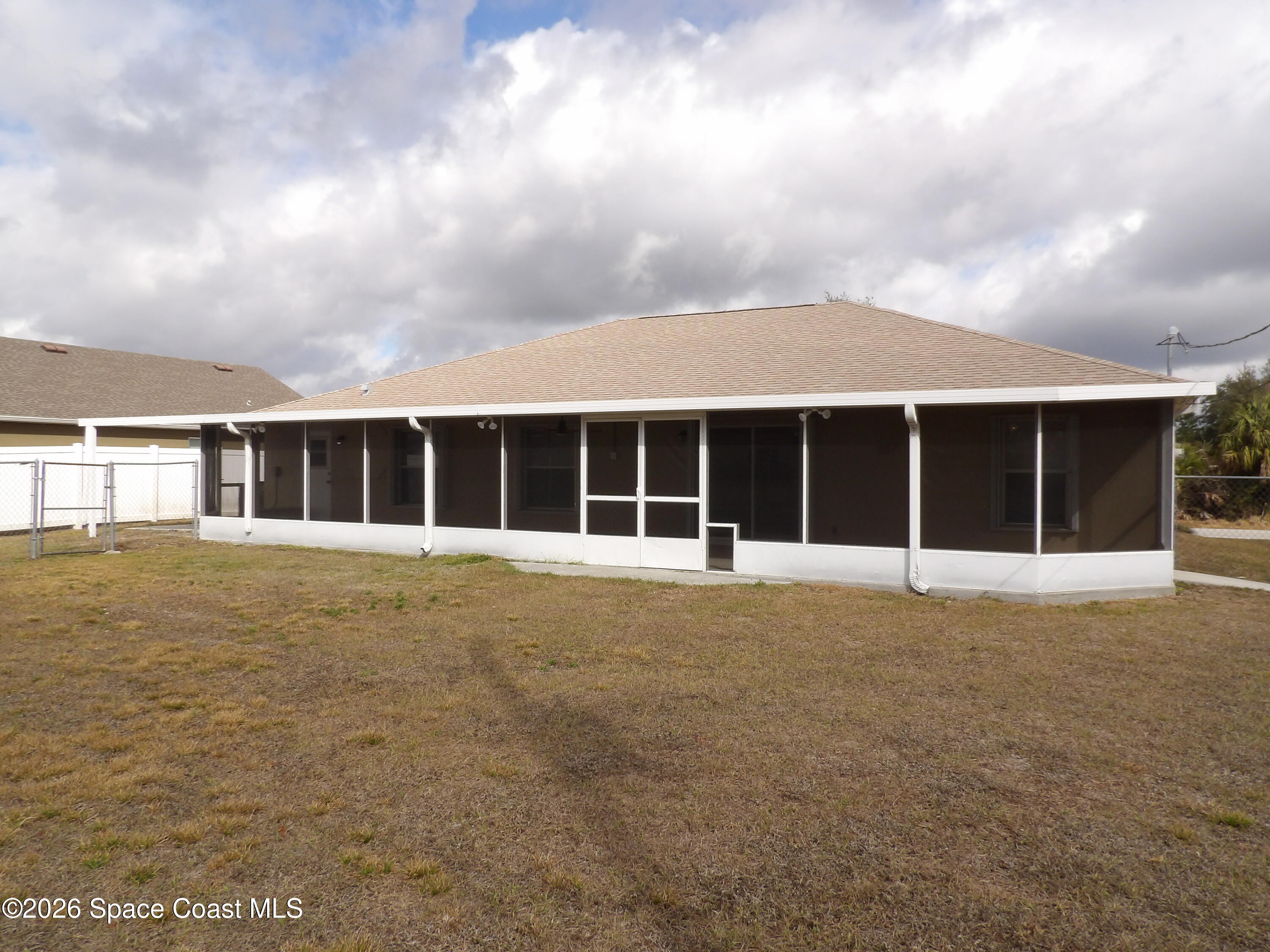 542 Octavius Road Southwest Palm Bay, FL 32908 - Photo 32 of 33 a front view of a house with a garden