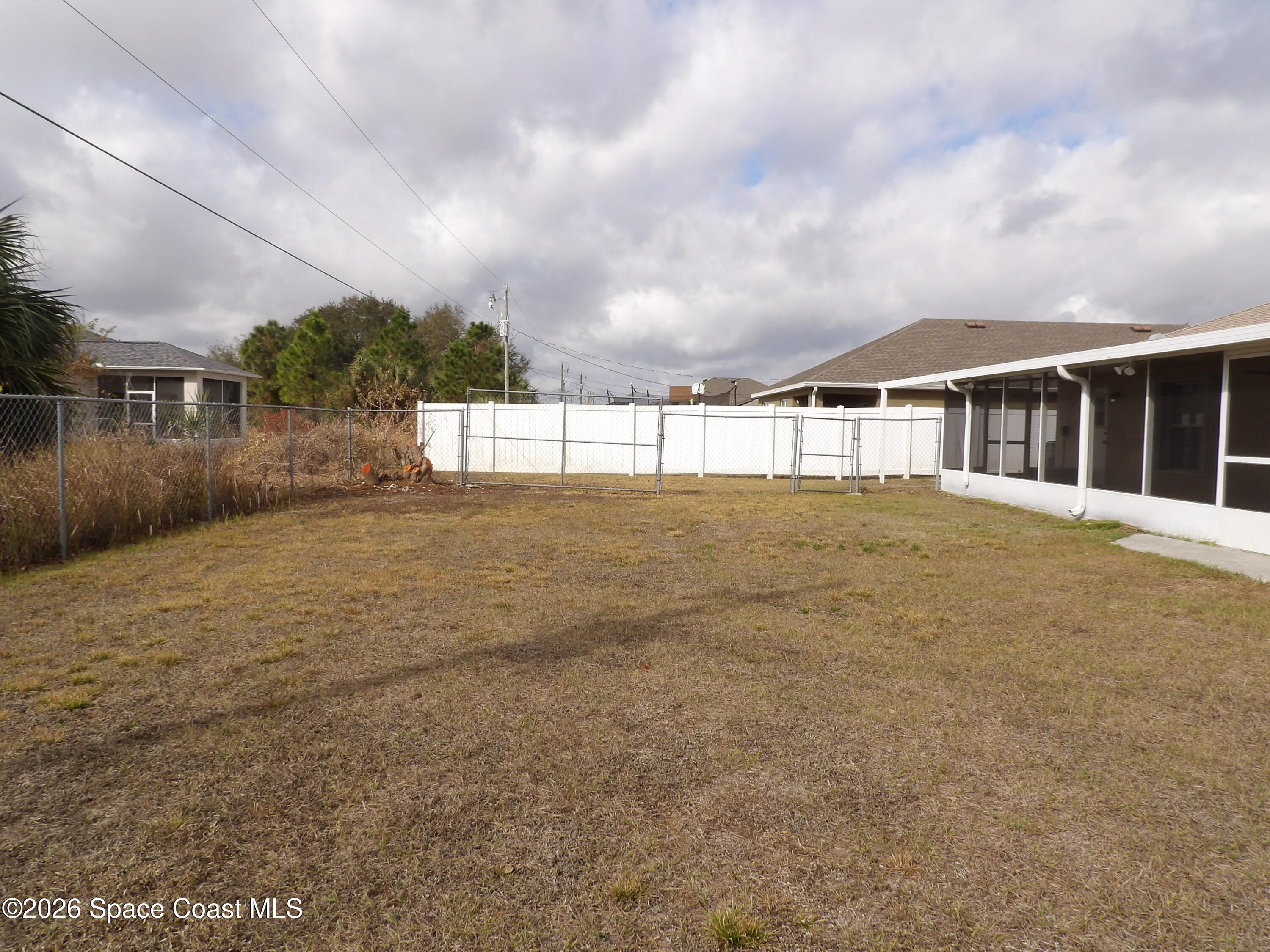 542 Octavius Road Southwest Palm Bay, FL 32908 - Photo 33 of 33 a view of house with yard and entertaining space