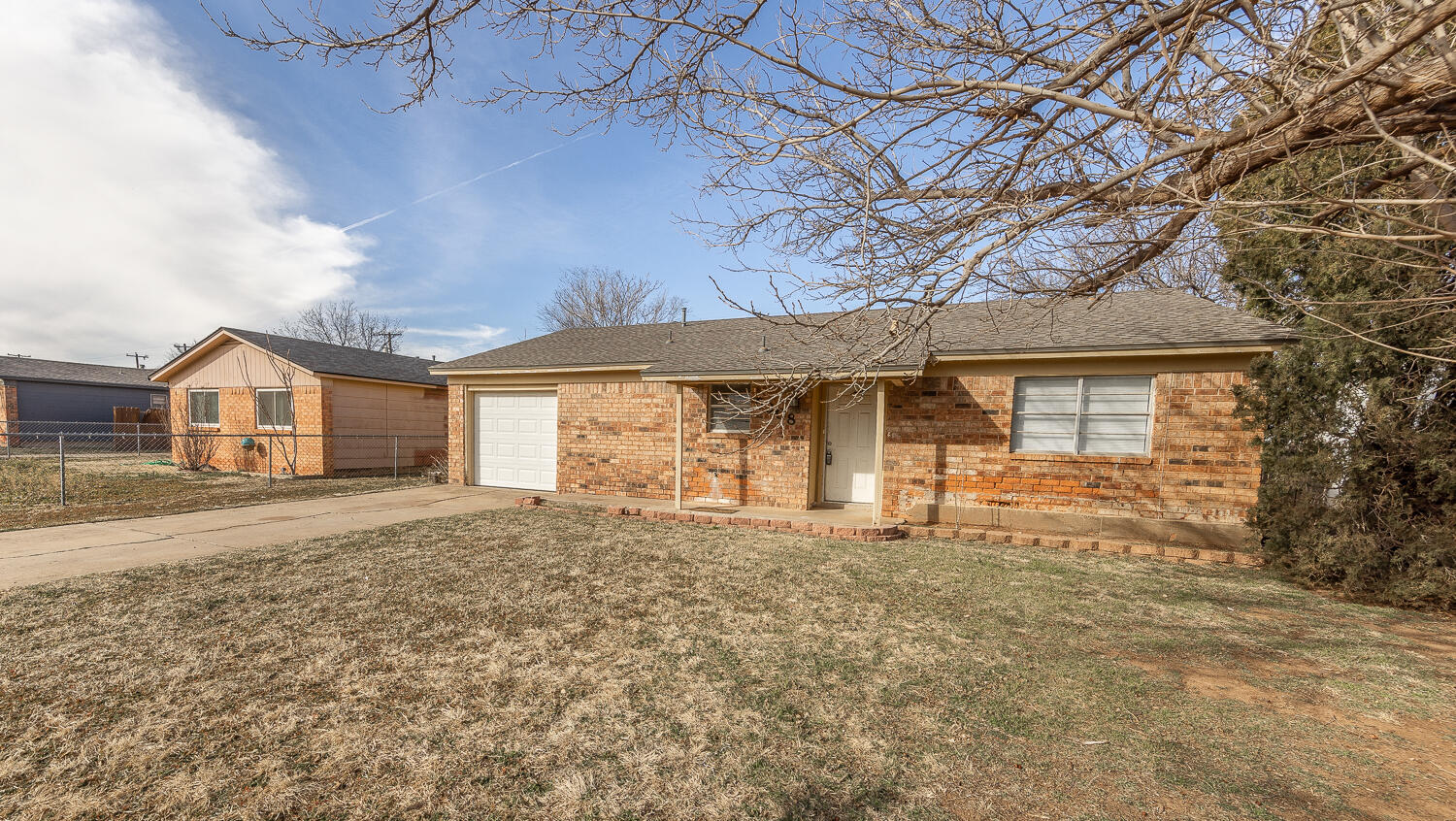 5308 23rd Street Lubbock, TX 79407 - Photo 3 of 25 a front view of a house with a yard