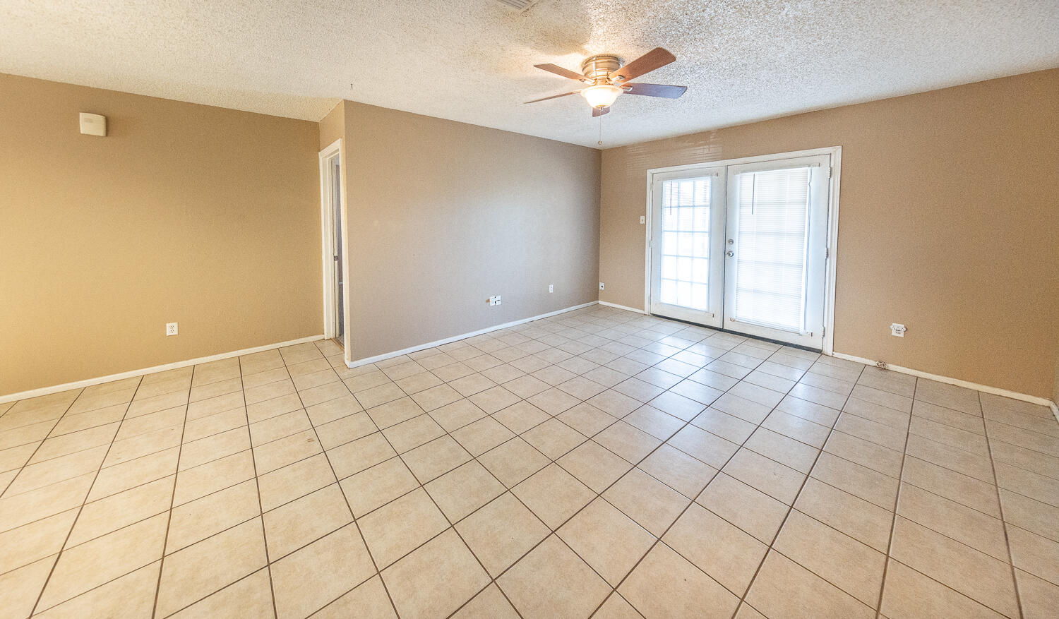 5308 23rd Street Lubbock, TX 79407 - Photo 6 of 25 a view of an empty room and window
