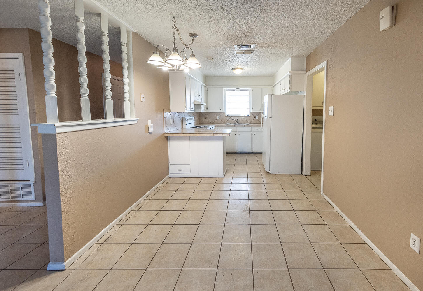 5308 23rd Street Lubbock, TX 79407 - Photo 9 of 25 a view of a kitchen with a sink and cabinets