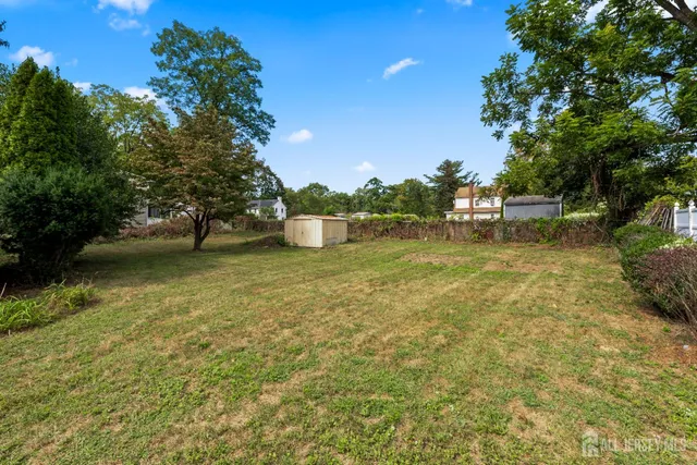 a view of a lake with houses in the back