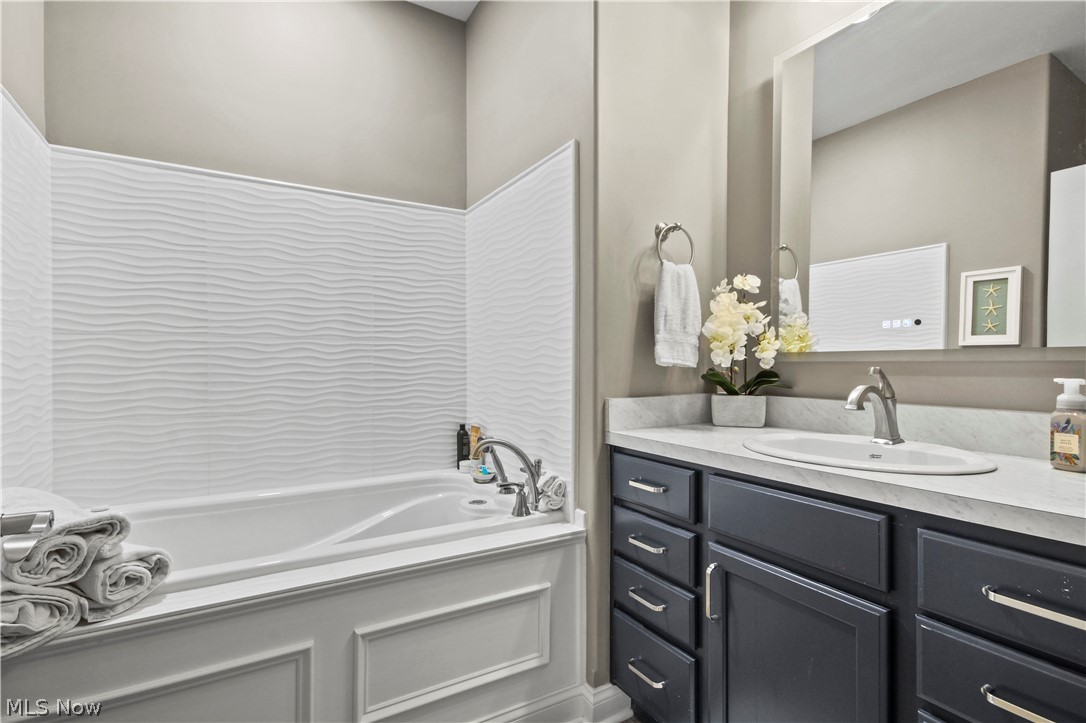 1805 East Western Reserve Road Youngstown, OH 44514 - Photo 11 of 31 Bathroom featuring a bathing tub and vanity