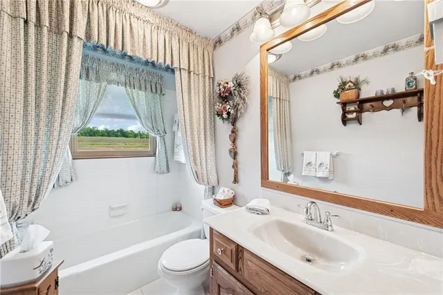 a bathroom with a sink a toilet and a bathtub
