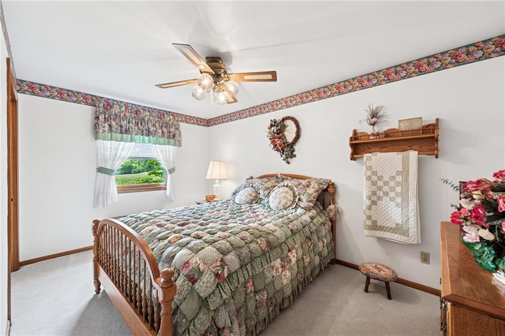 207 State Park Road New Alexandria, PA 15670 - Photo 18 of 38 a bedroom with a bed and a table in it