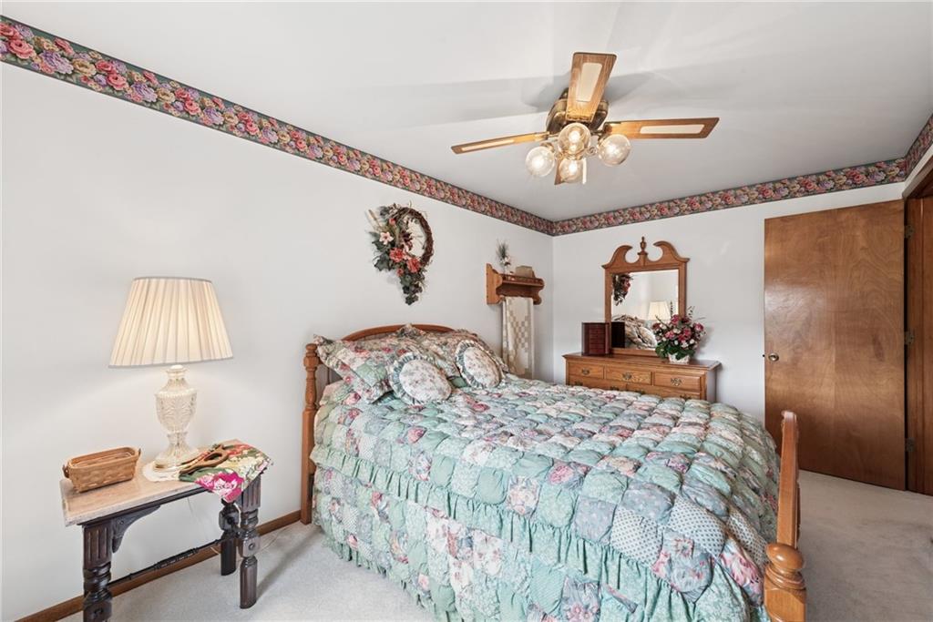 207 State Park Road New Alexandria, PA 15670 - Photo 19 of 38 a bedroom with a bed and a lamp on table
