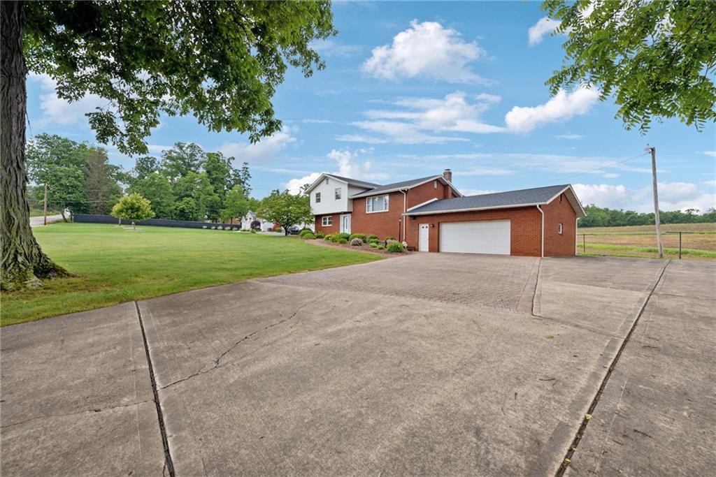 207 State Park Road New Alexandria, PA 15670 - Photo 2 of 38 a house view with a garden
