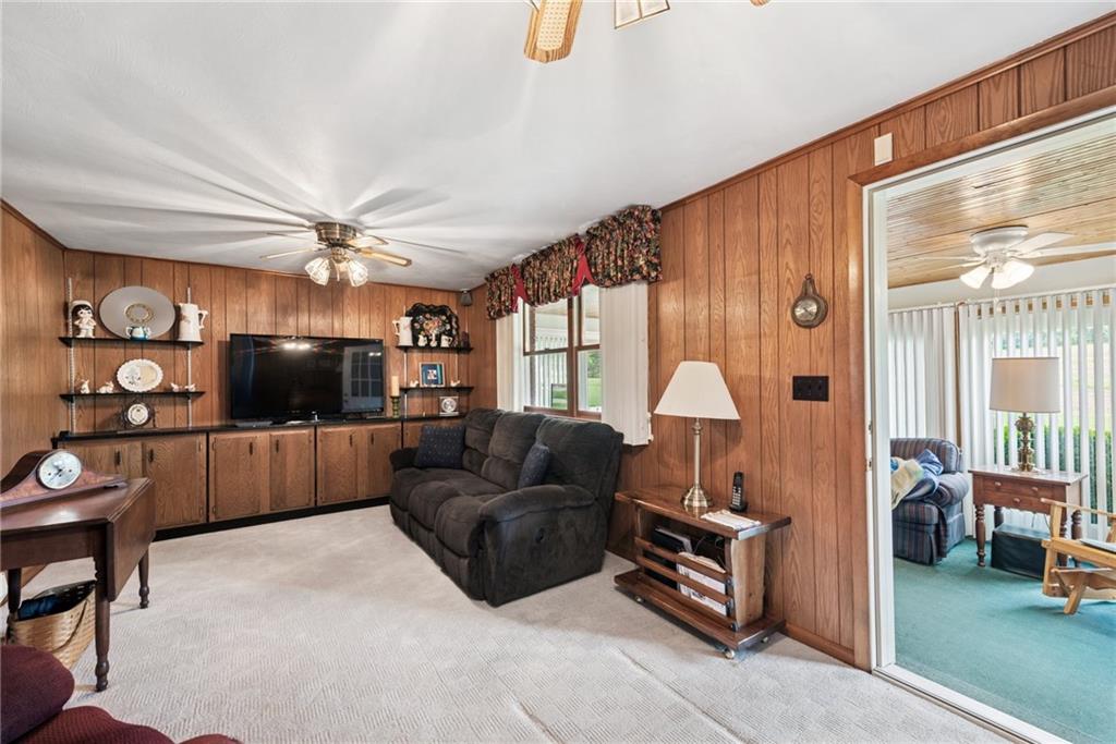 207 State Park Road New Alexandria, PA 15670 - Photo 23 of 38 a living room with furniture and a flat screen tv