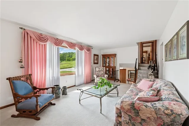 a bedroom with furniture and a window