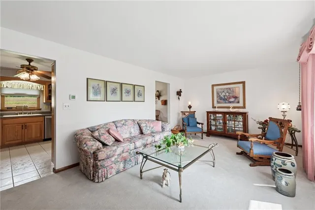 a living room with furniture and a bed
