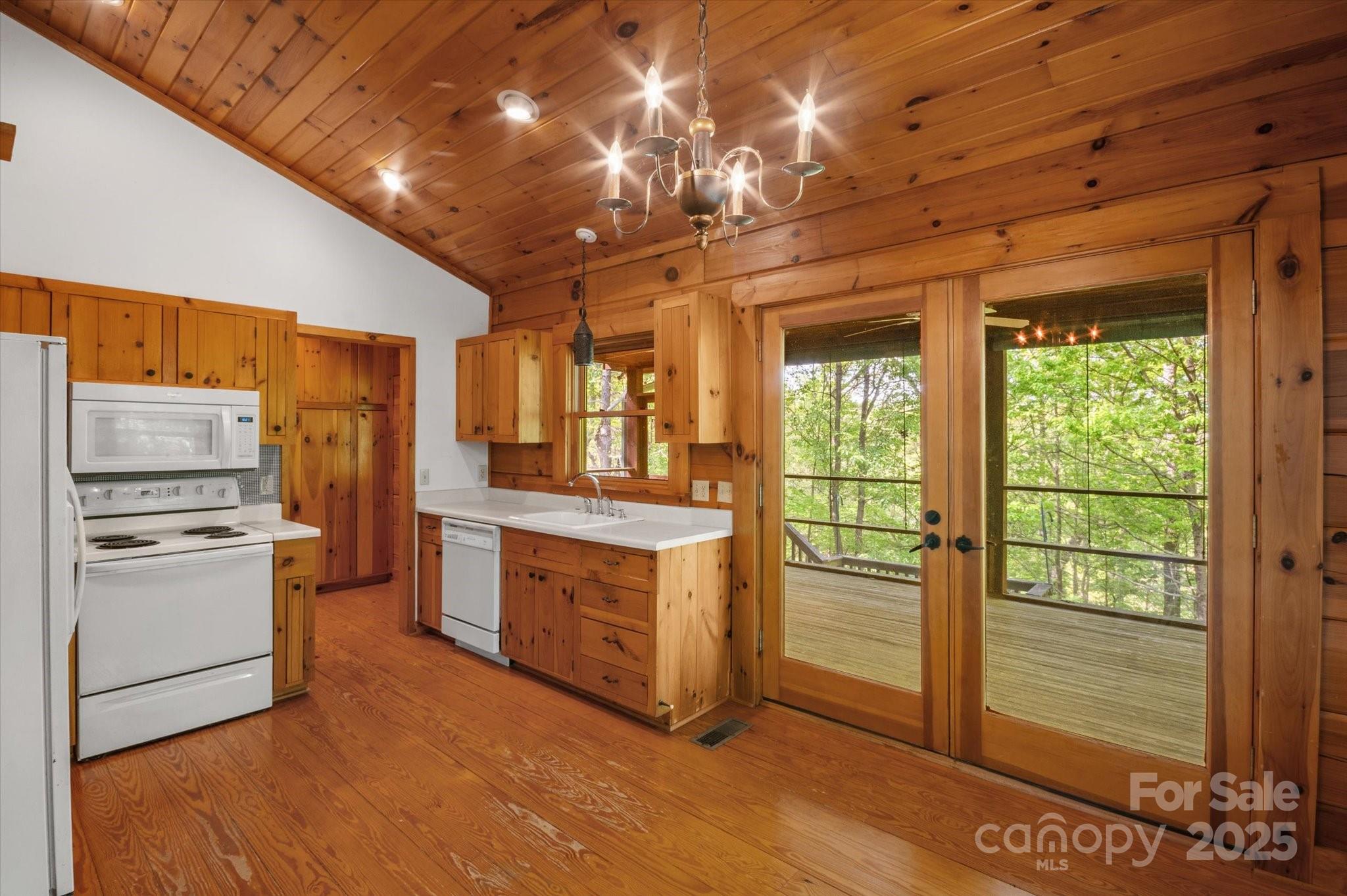 447 Cherokee Circle Tryon, NC 28782 - Photo 16 of 36 a kitchen with stove and refrigerator