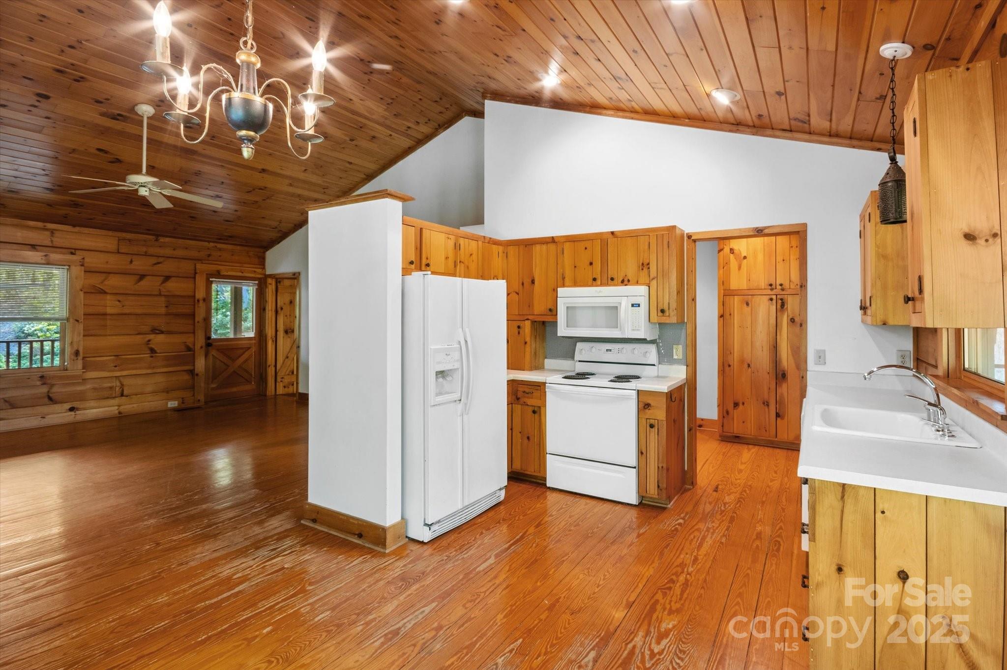 447 Cherokee Circle Tryon, NC 28782 - Photo 18 of 36 a kitchen with stainless steel appliances a refrigerator and a stove