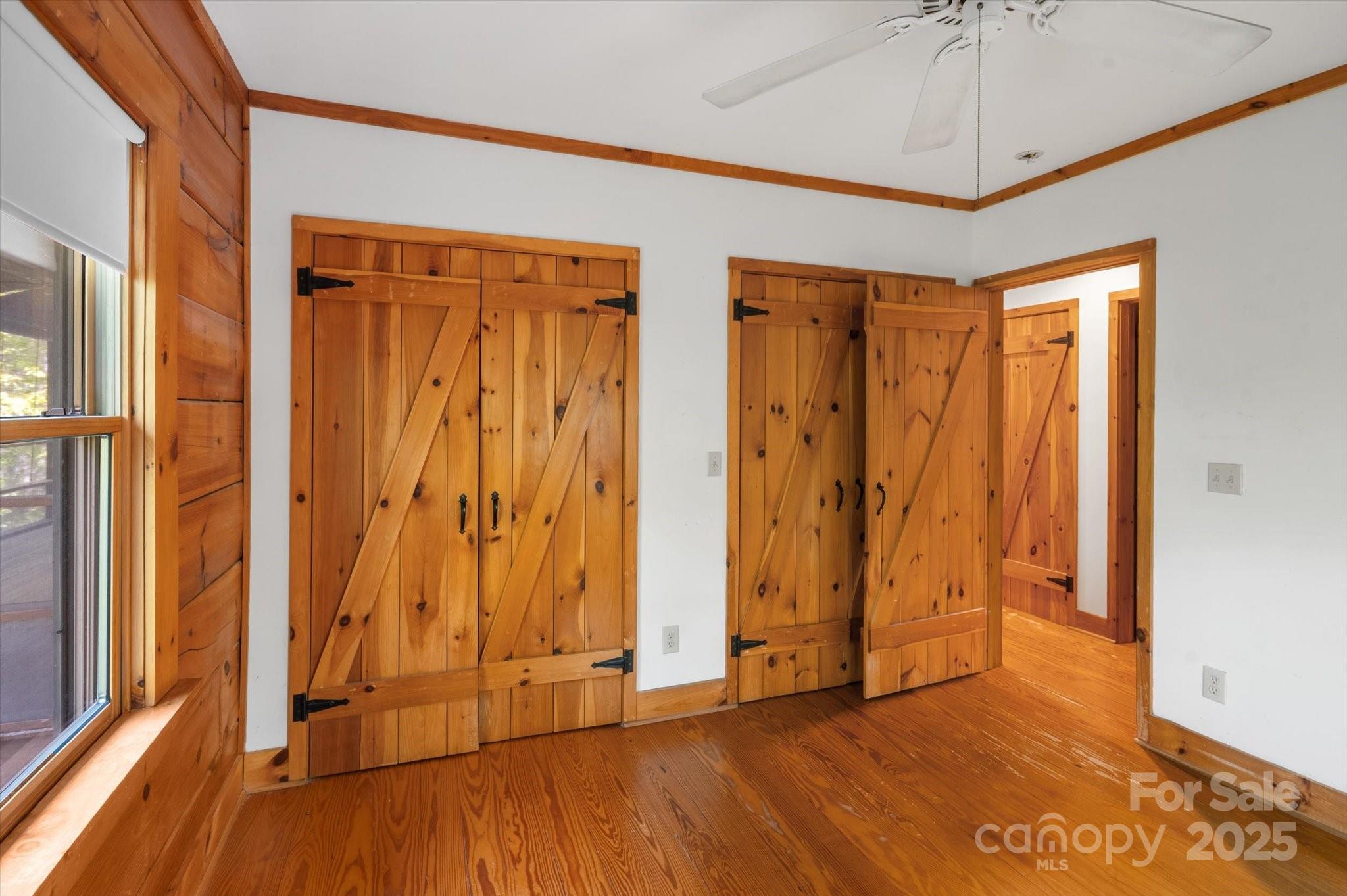 447 Cherokee Circle Tryon, NC 28782 - Photo 24 of 36 a view of a room with wooden floor and door