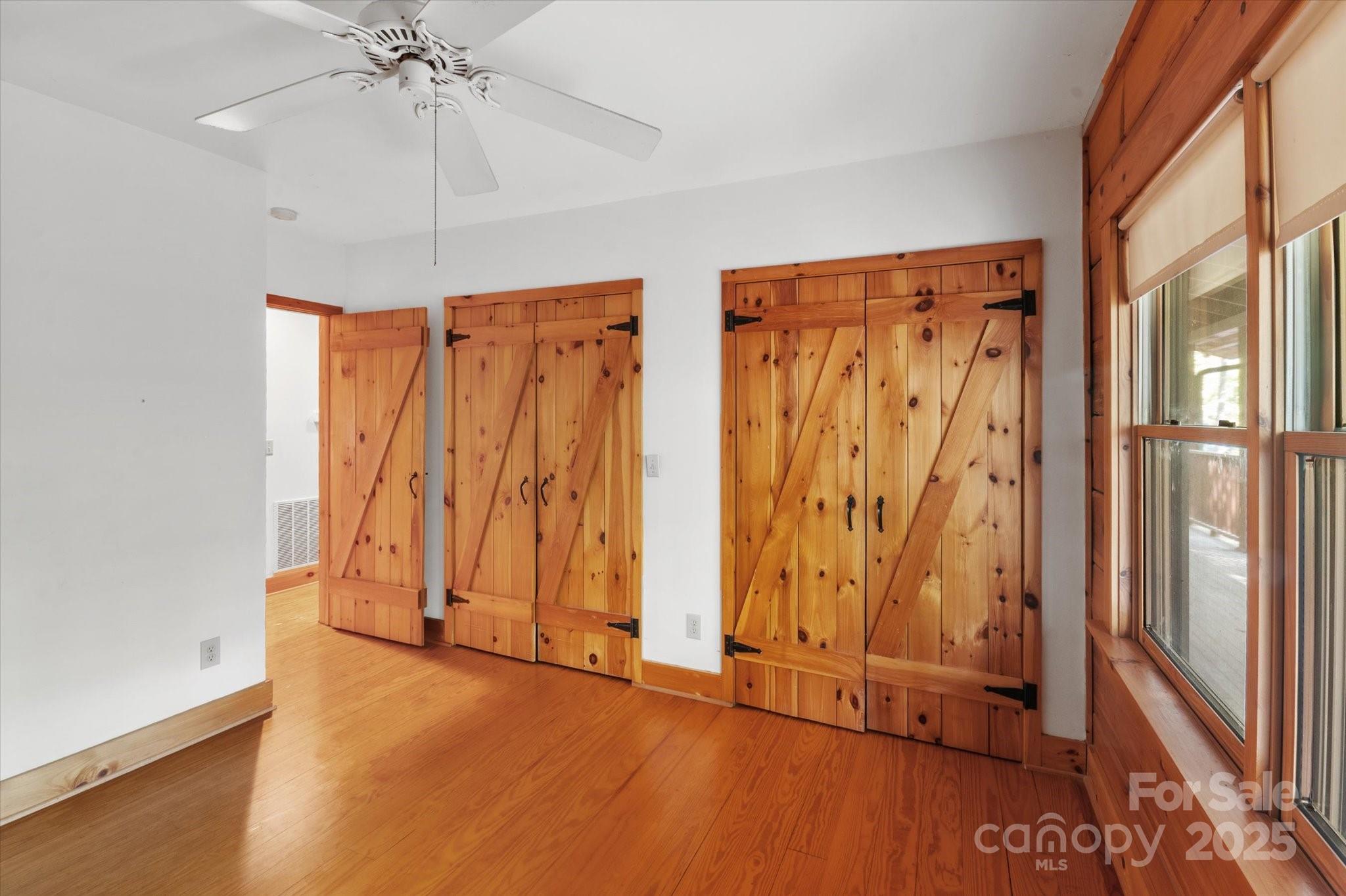 447 Cherokee Circle Tryon, NC 28782 - Photo 27 of 36 wooden floor in an empty room with a window