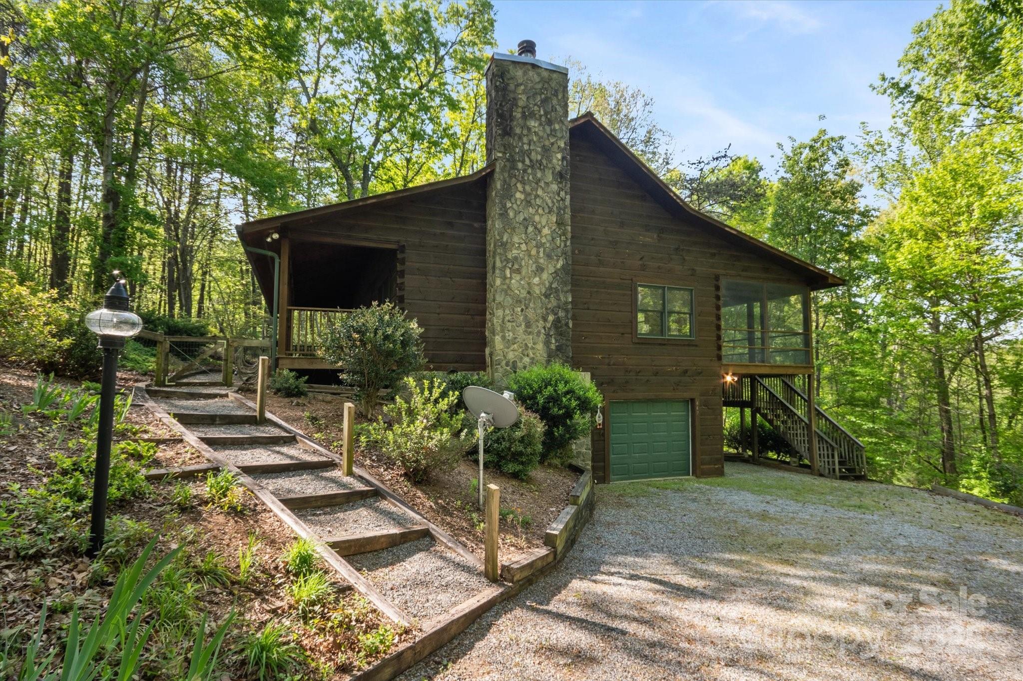 447 Cherokee Circle Tryon, NC 28782 - Photo 3 of 36 a backyard of a house with seating space