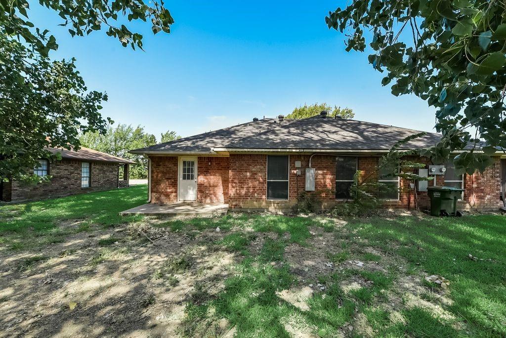 919 Farmington Road, Unit 919 Howe, TX 75459 - Photo 13 of 14 a front view of a house with a garden