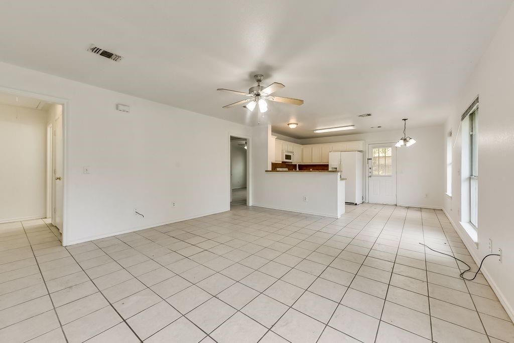 919 Farmington Road, Unit 919 Howe, TX 75459 - Photo 5 of 14 a view of a kitchen with a sink and a refrigerator