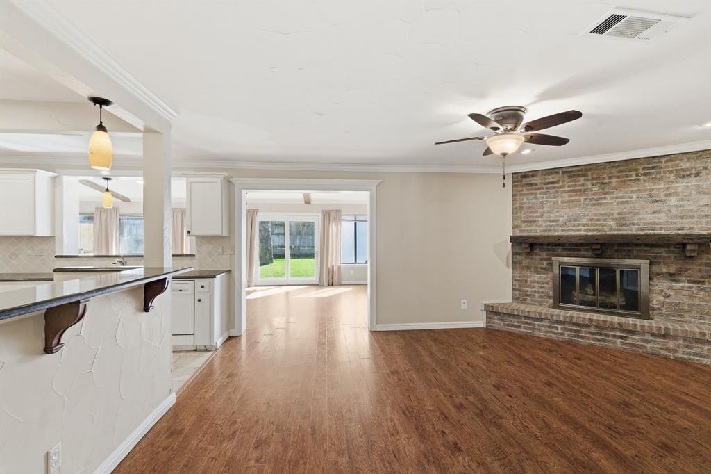 1760 Acorn Lane Hurst, TX 76054 - Photo 14 of 36 wooden floor in an empty room with a window