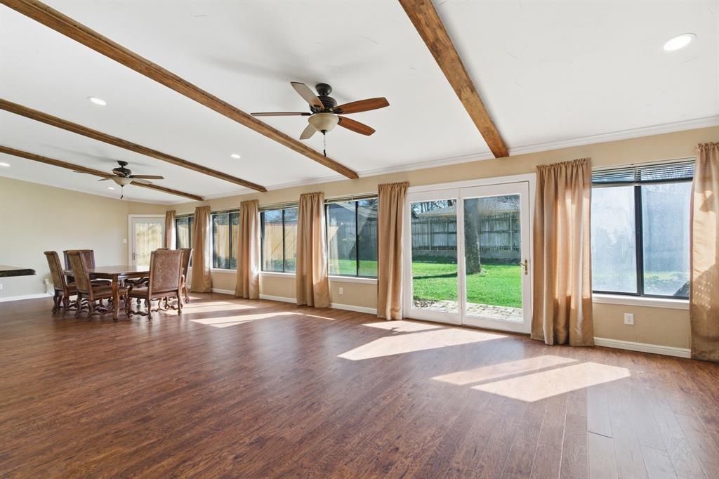 1760 Acorn Lane Hurst, TX 76054 - Photo 16 of 36 a view of empty room with wooden floor and fan