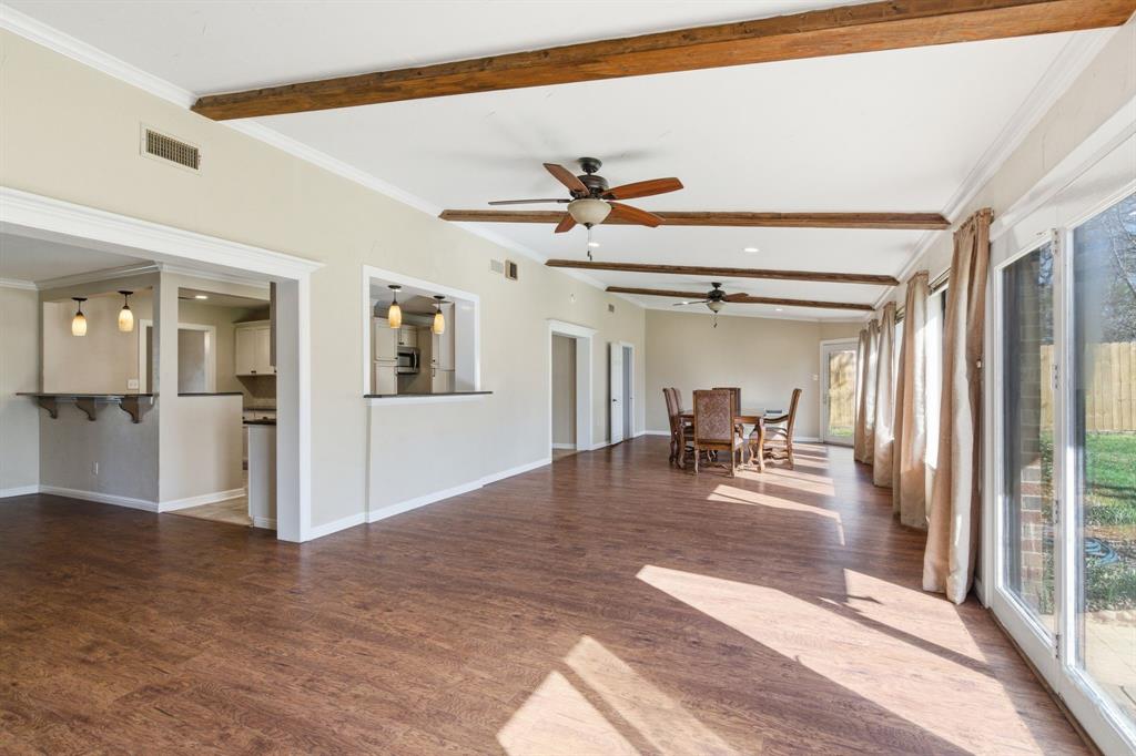 1760 Acorn Lane Hurst, TX 76054 - Photo 18 of 36 a view of a living room and dining room with wooden floor
