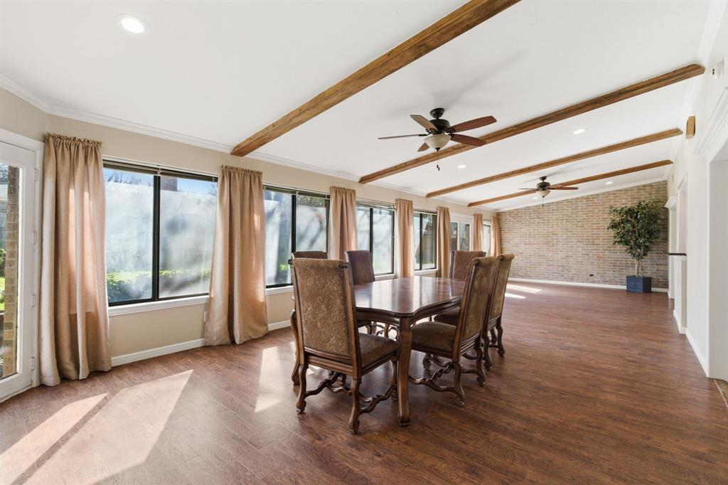 1760 Acorn Lane Hurst, TX 76054 - Photo 19 of 36 a dining room with furniture window and wooden floor