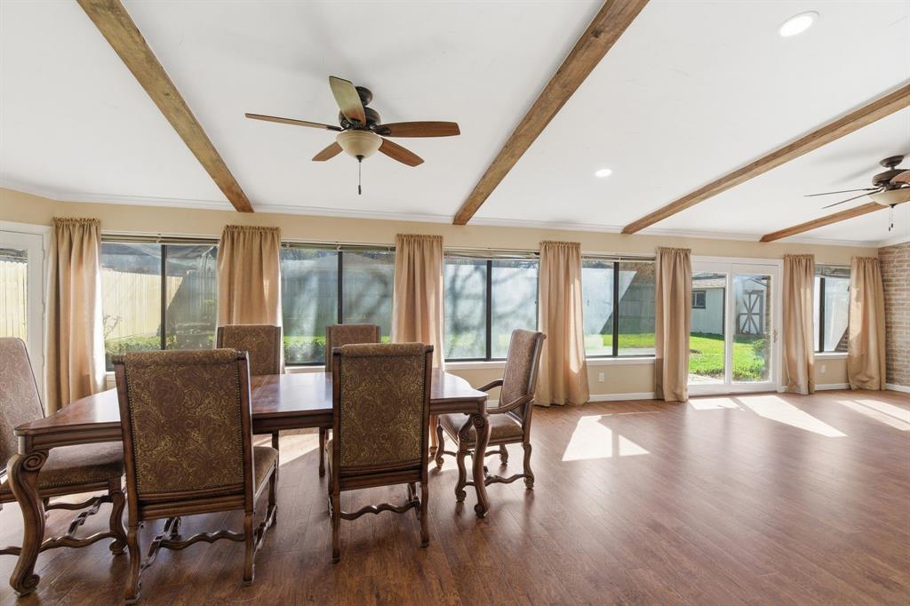 1760 Acorn Lane Hurst, TX 76054 - Photo 20 of 36 a view of a dining room with furniture window and wooden floor