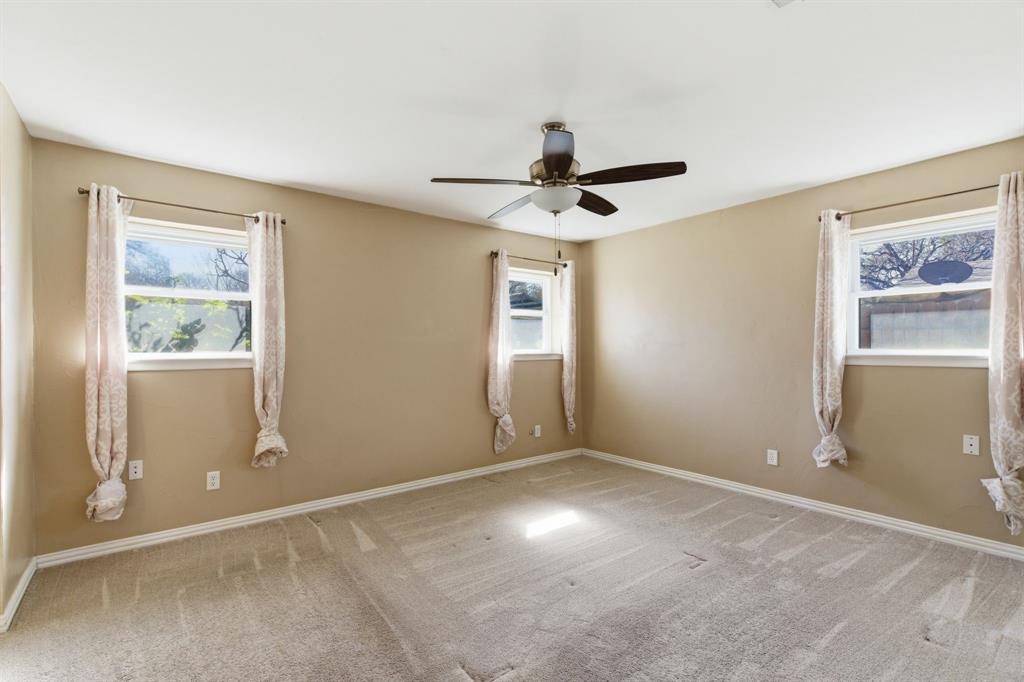 1760 Acorn Lane Hurst, TX 76054 - Photo 21 of 36 a view of an empty room with a window