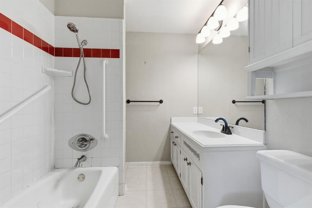 1760 Acorn Lane Hurst, TX 76054 - Photo 23 of 36 a bathroom with a double vanity sink a mirror a shower and vanity