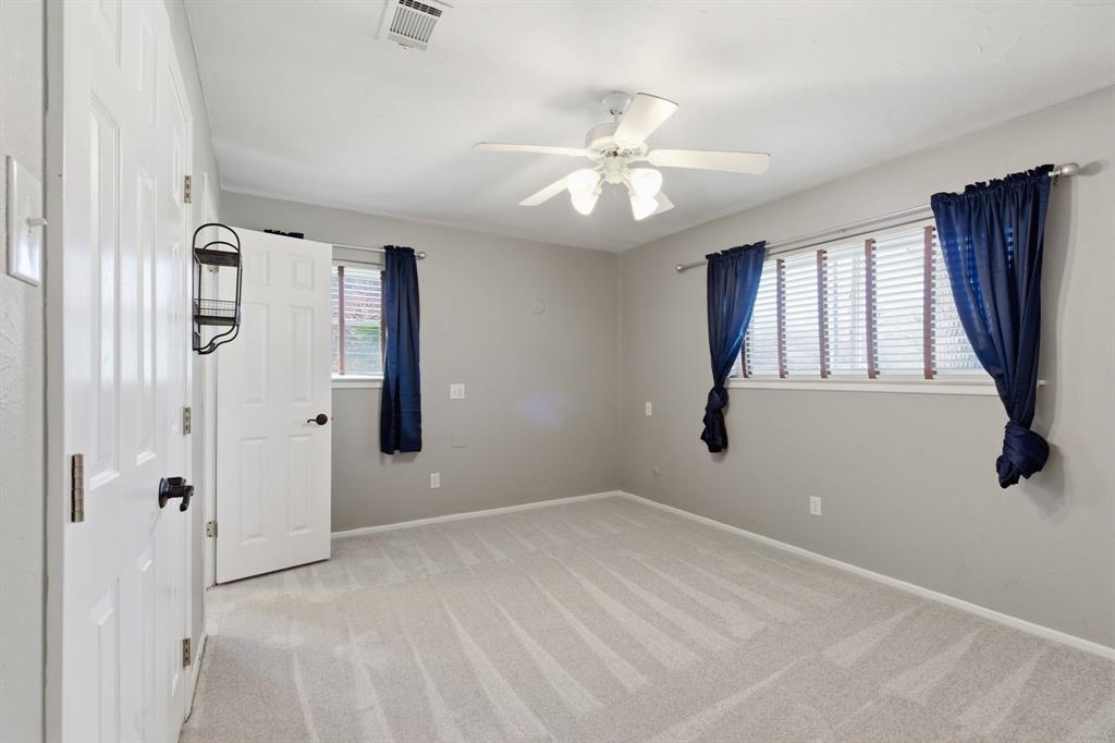 1760 Acorn Lane Hurst, TX 76054 - Photo 26 of 36 wooden floor in an empty room with a window