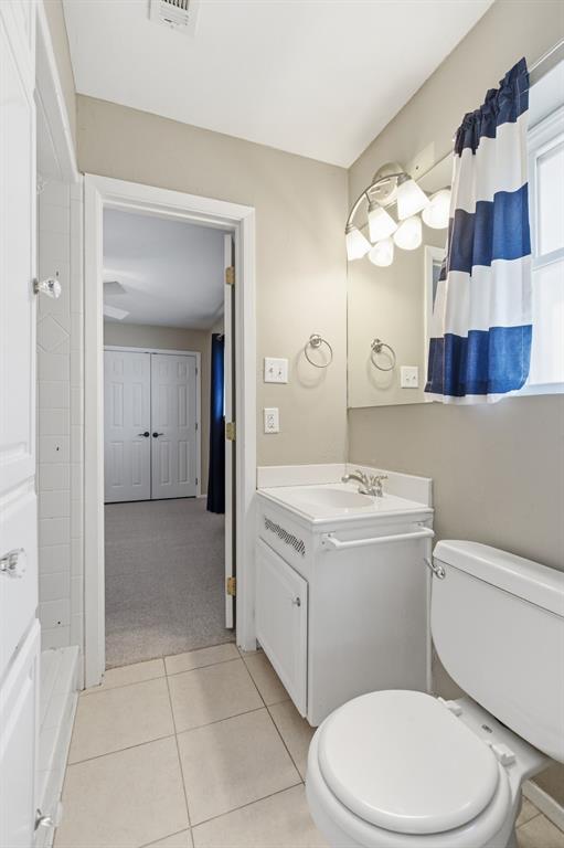 1760 Acorn Lane Hurst, TX 76054 - Photo 28 of 36 a bathroom with a sink a toilet and shower