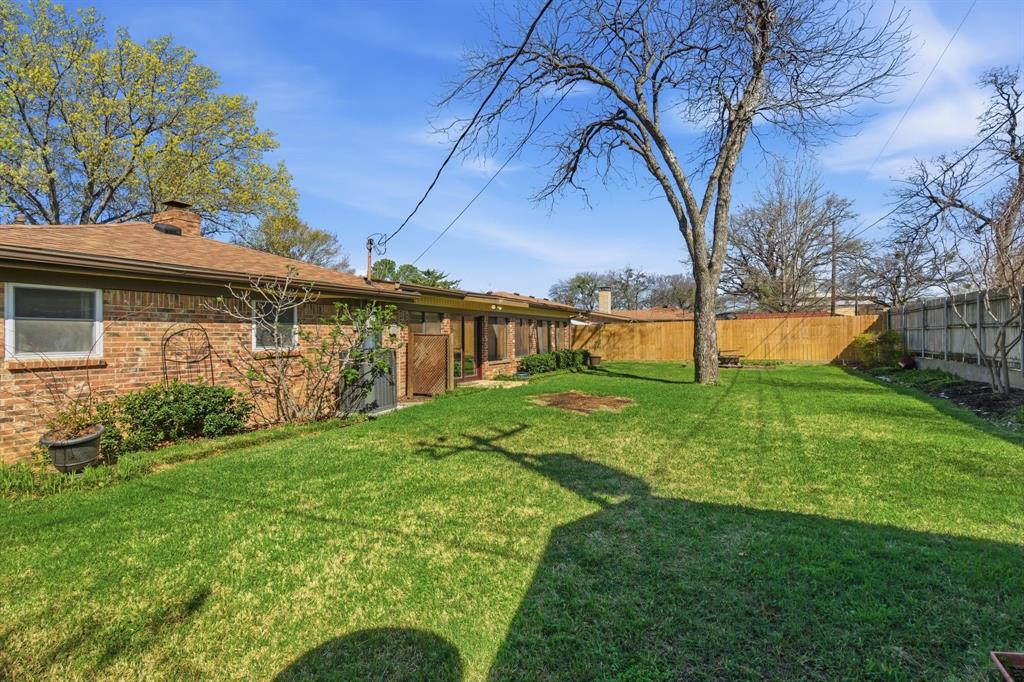 1760 Acorn Lane Hurst, TX 76054 - Photo 34 of 36 a view of a house with a backyard