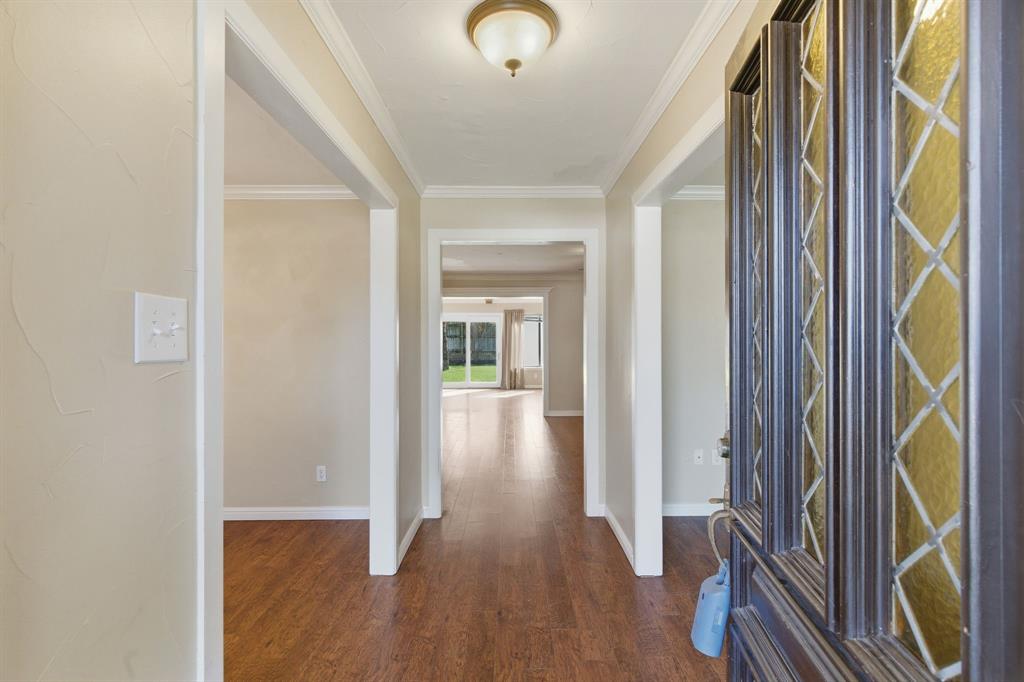1760 Acorn Lane Hurst, TX 76054 - Photo 4 of 36 a view of entryway with wooden floor