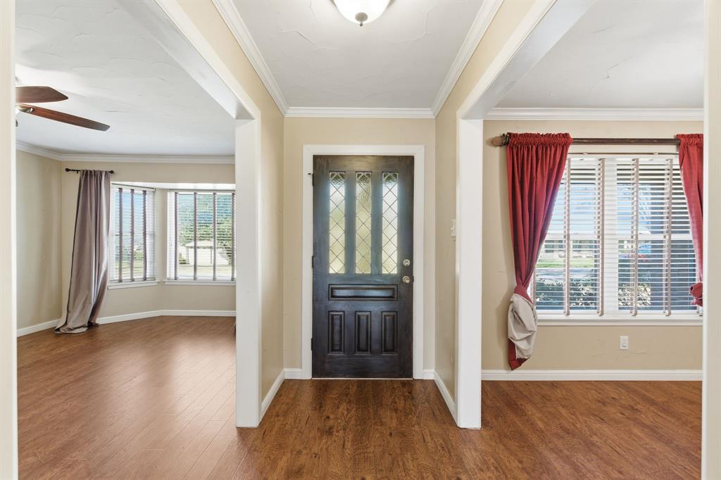 1760 Acorn Lane Hurst, TX 76054 - Photo 5 of 36 wooden floor in an empty room with a window