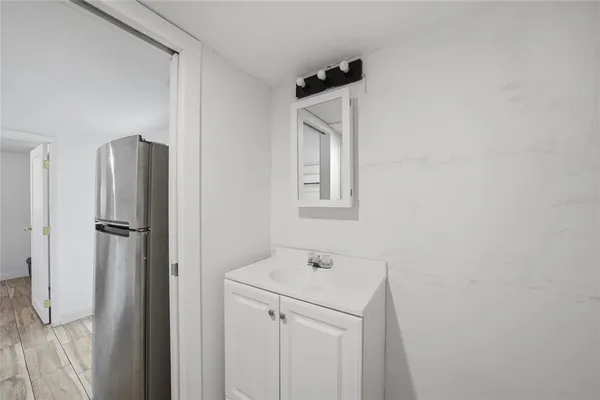 a bathroom with a sink and a mirror