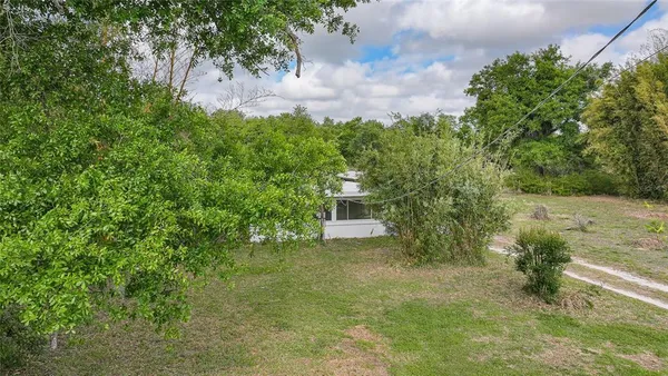 a backyard of a house with lots of green space