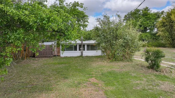a house with trees in front of it