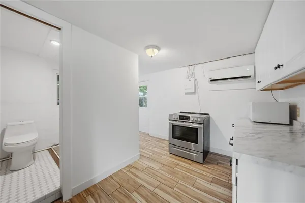 a kitchen with a sink and a stove top oven