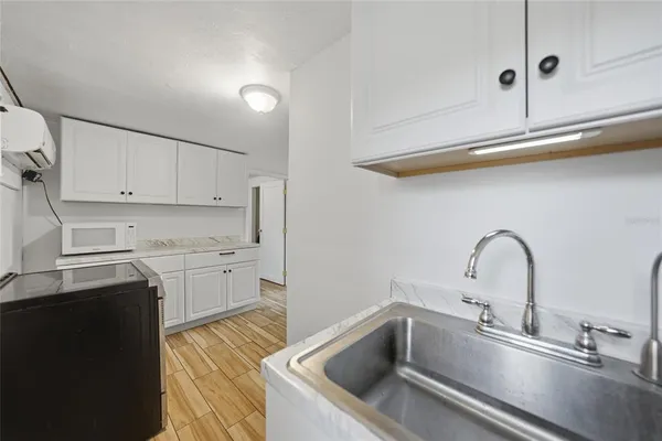 a kitchen with a sink and cabinets