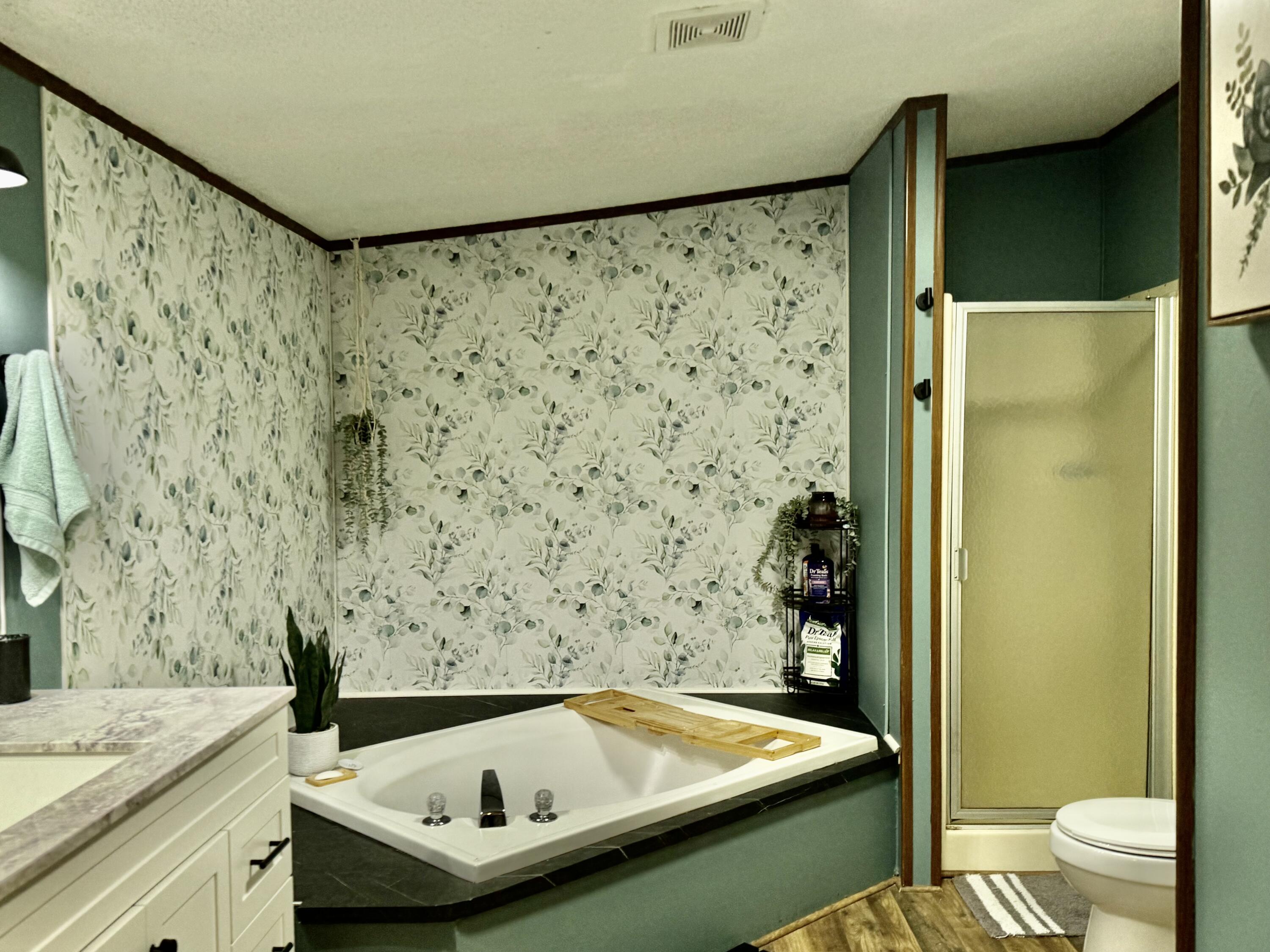 6249 Joppa Mill Road Moneta, VA 24121 - Photo 14 of 55 a bathroom with a sink and a bathtub