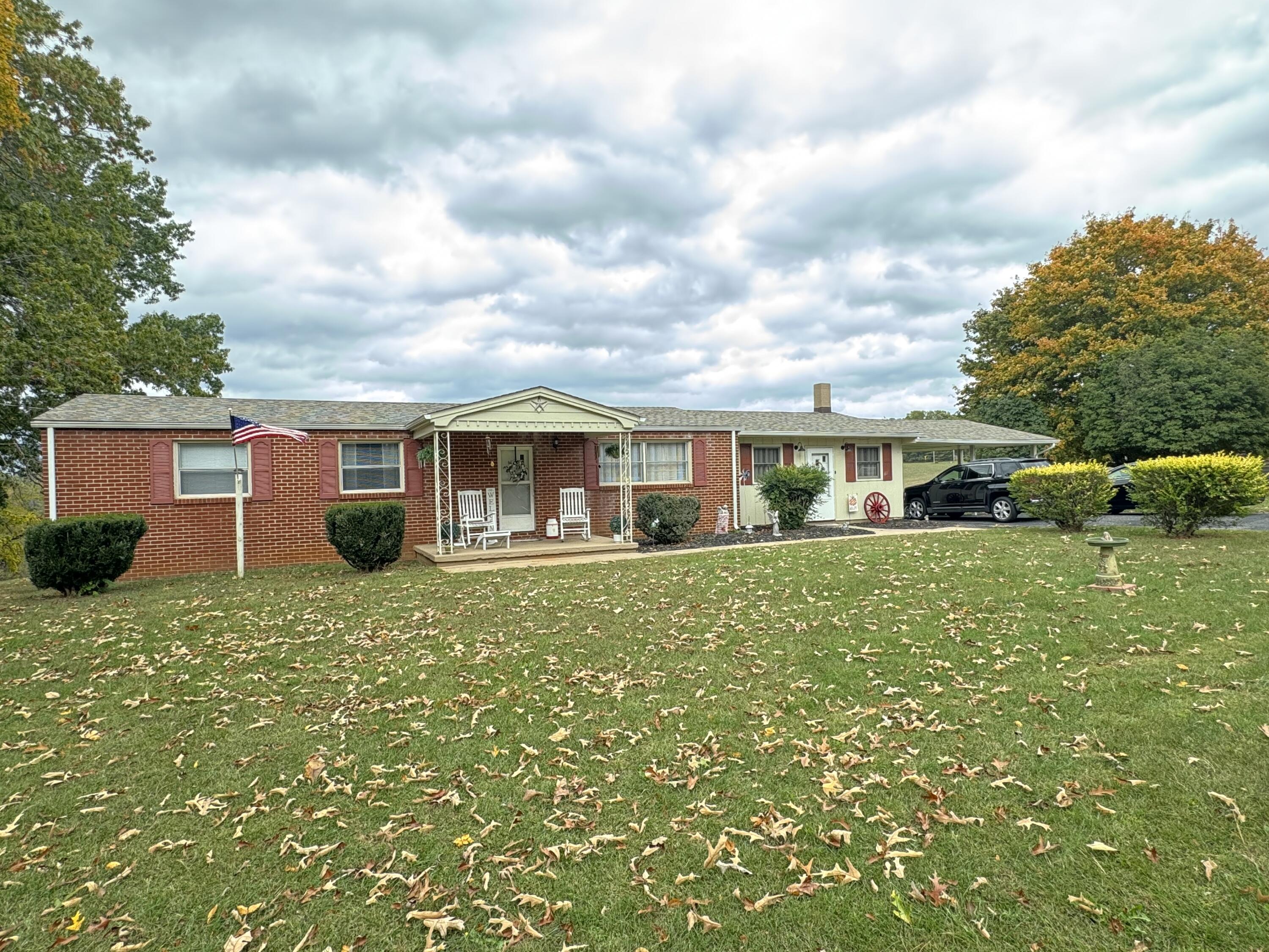 6249 Joppa Mill Road Moneta, VA 24121 - Photo 26 of 55 a front view of a house with a garden