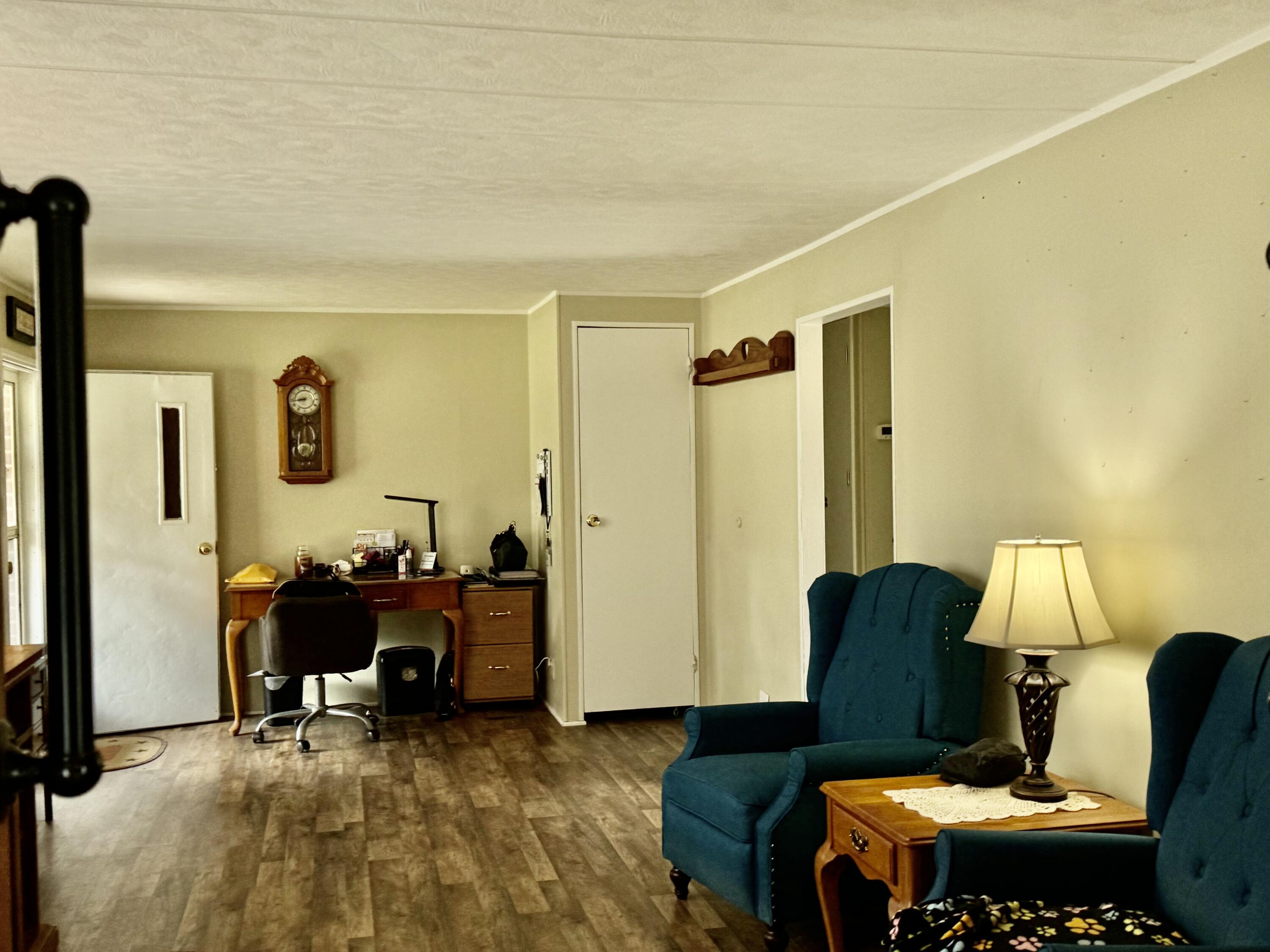 6249 Joppa Mill Road Moneta, VA 24121 - Photo 28 of 55 a living room with furniture and a window