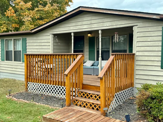 a view of outdoor space with deck and furniture