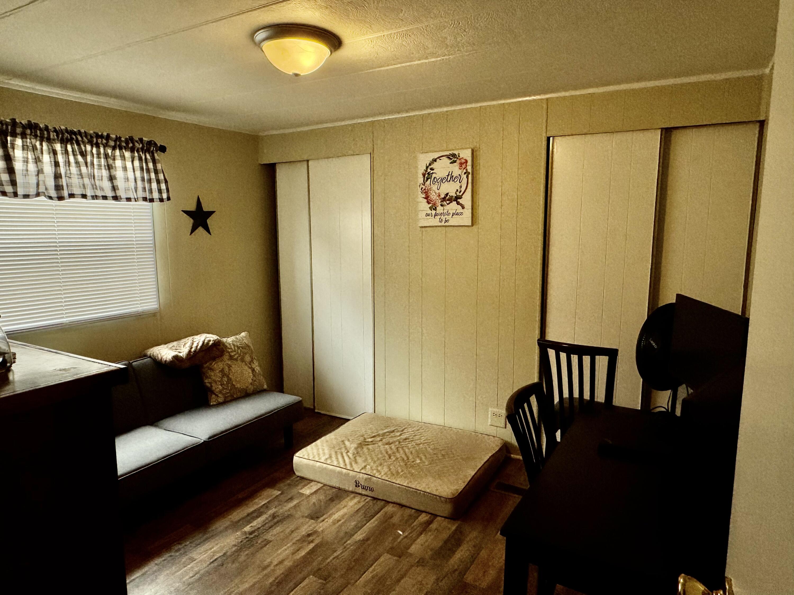 6249 Joppa Mill Road Moneta, VA 24121 - Photo 37 of 55 a bedroom with a bed and wooden floor