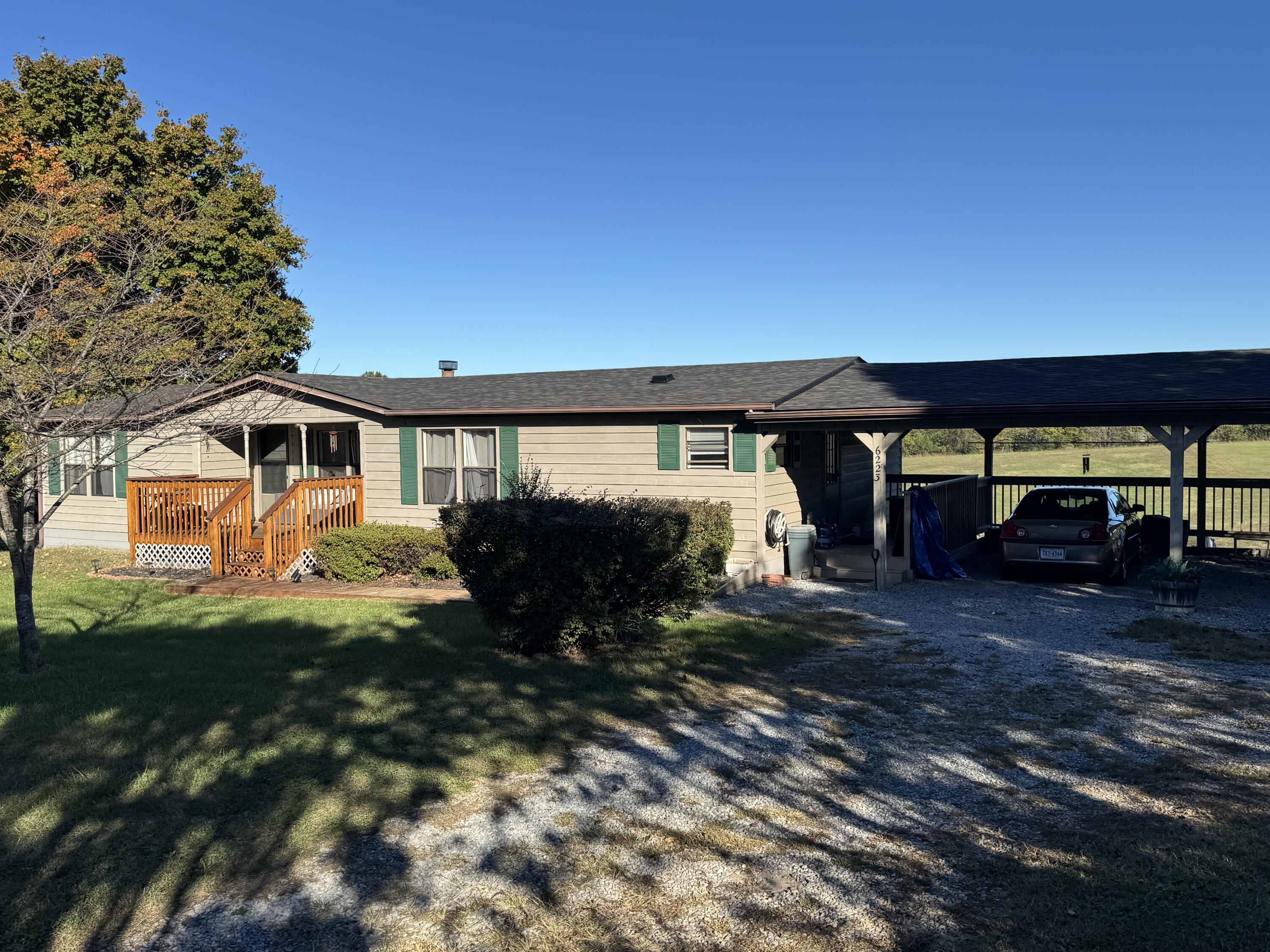 6249 Joppa Mill Road Moneta, VA 24121 - Photo 4 of 55 a view of a house with backyard porch and sitting area