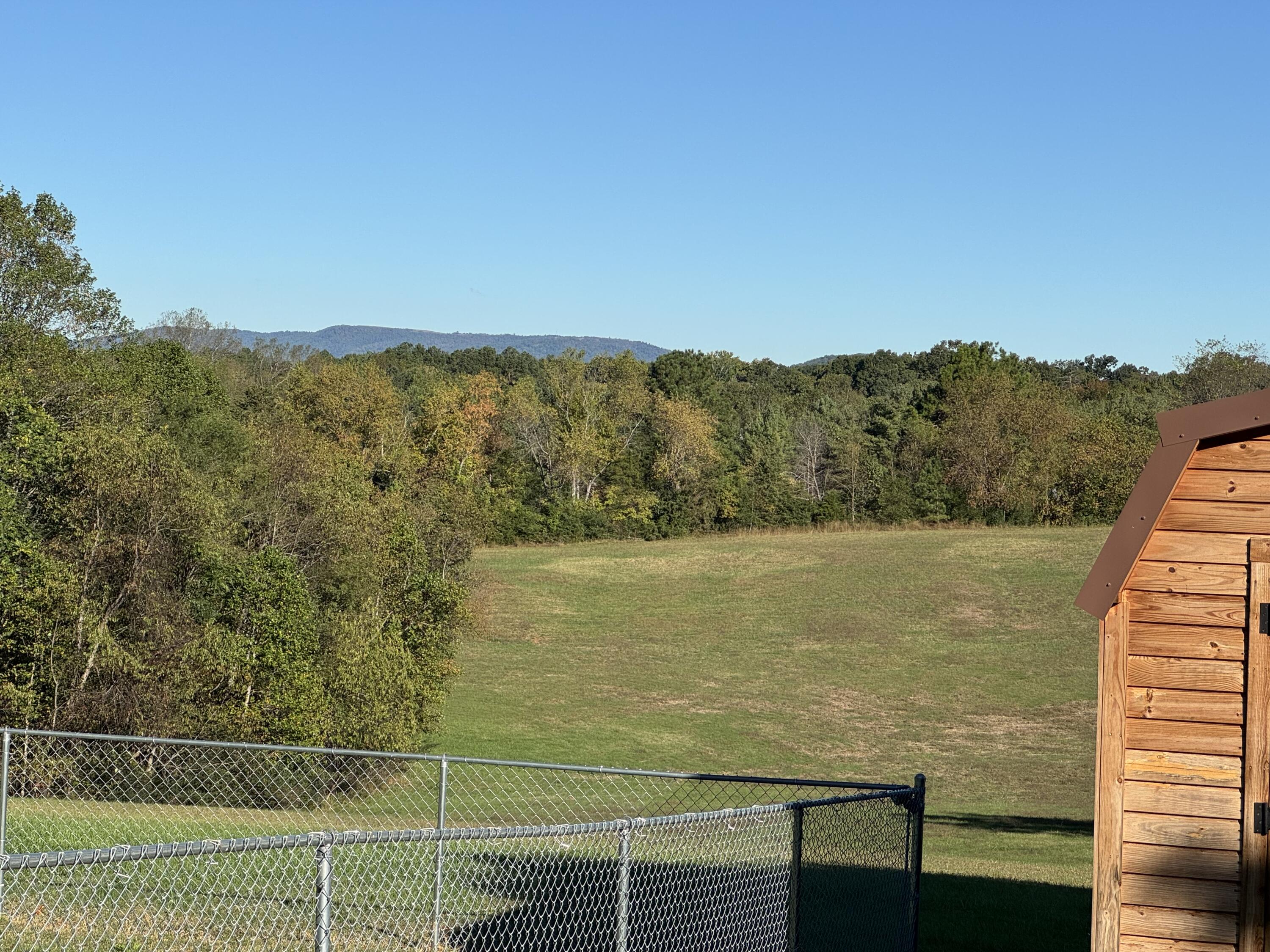 6249 Joppa Mill Road Moneta, VA 24121 - Photo 49 of 55 a view of a lake with a mountain