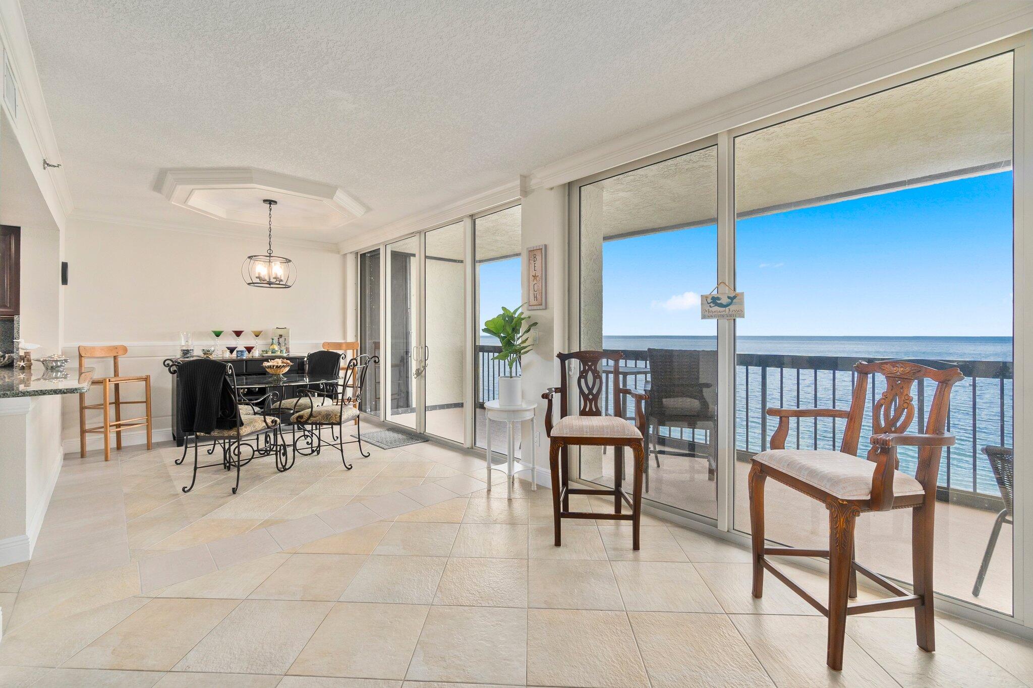 3100 North Hwy A1A, Unit PHA4 Fort Pierce, FL 34949 - Photo 13 of 54 a view of a dining room with furniture and a table