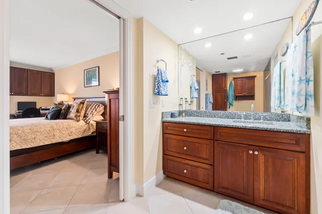 a bedroom with a large bed and a large window