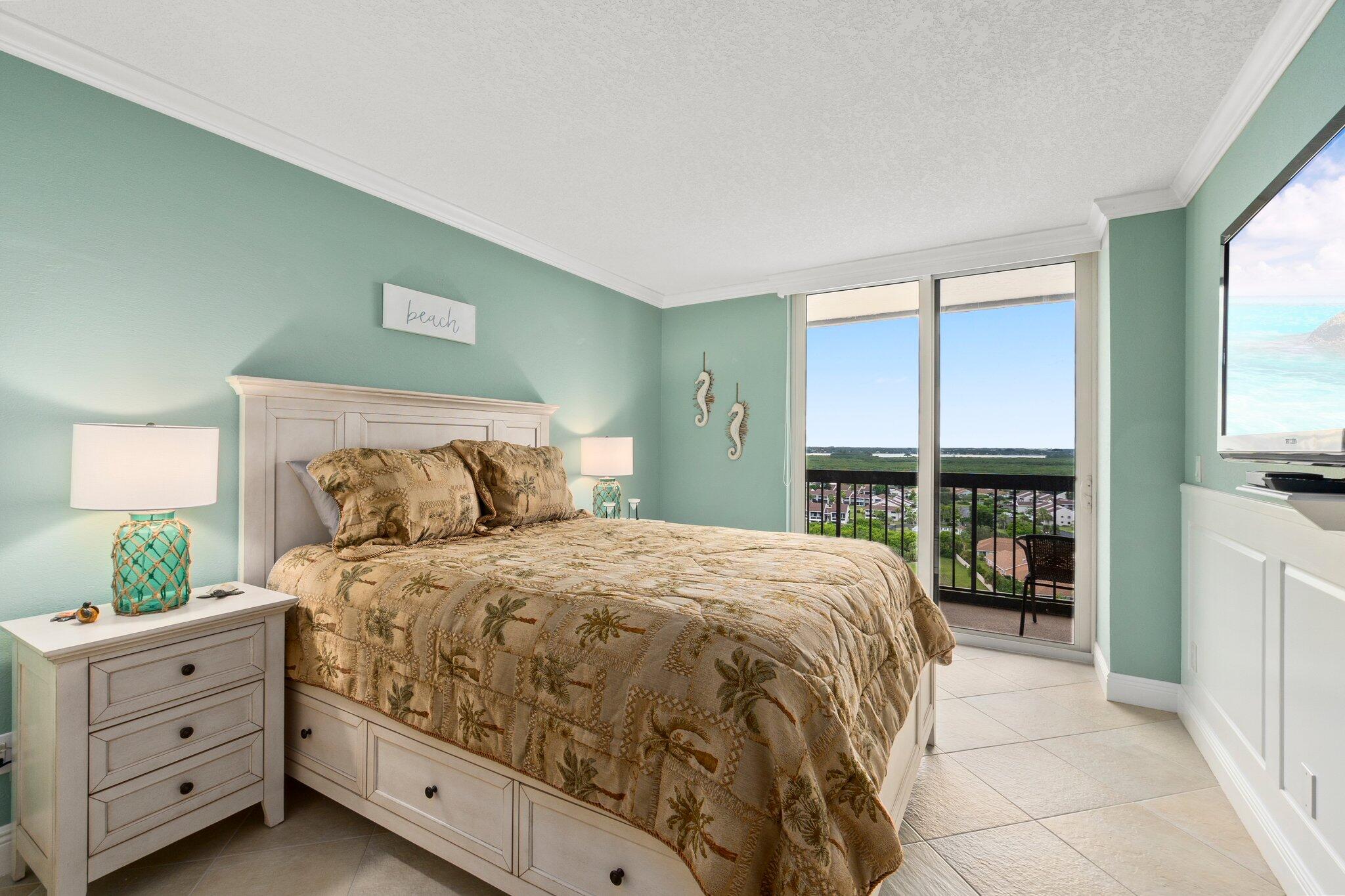 3100 North Hwy A1A, Unit PHA4 Fort Pierce, FL 34949 - Photo 32 of 54 a bedroom with a large bed and a large window