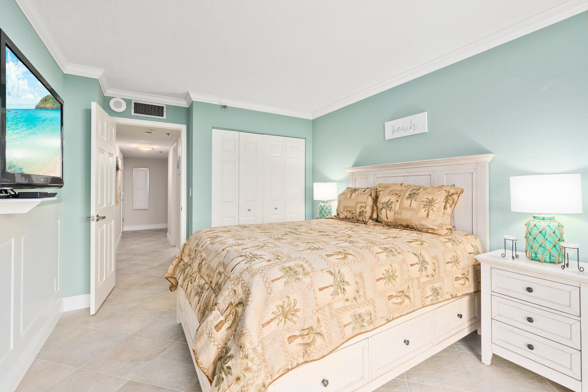 3100 North Hwy A1A, Unit PHA4 Fort Pierce, FL 34949 - Photo 33 of 54 a bedroom with a bed and a flat tv screen on dresser